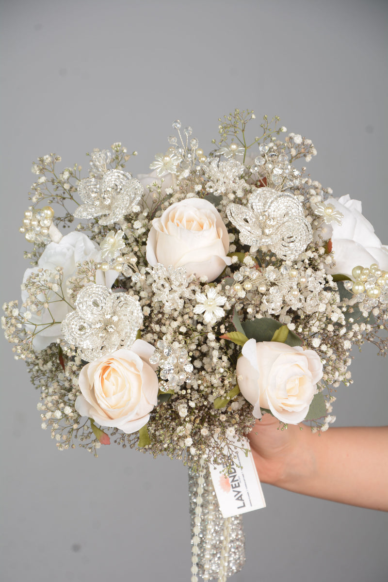 Artificial white roses .Natural white gypsophila. Hand made crystal Flower.Hand made Crystal and pearl 
Plastic white flower and crystal flower