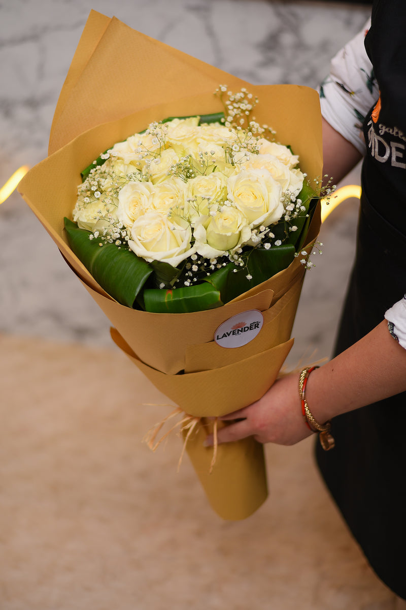 white roses .white gypsophila and green leaves