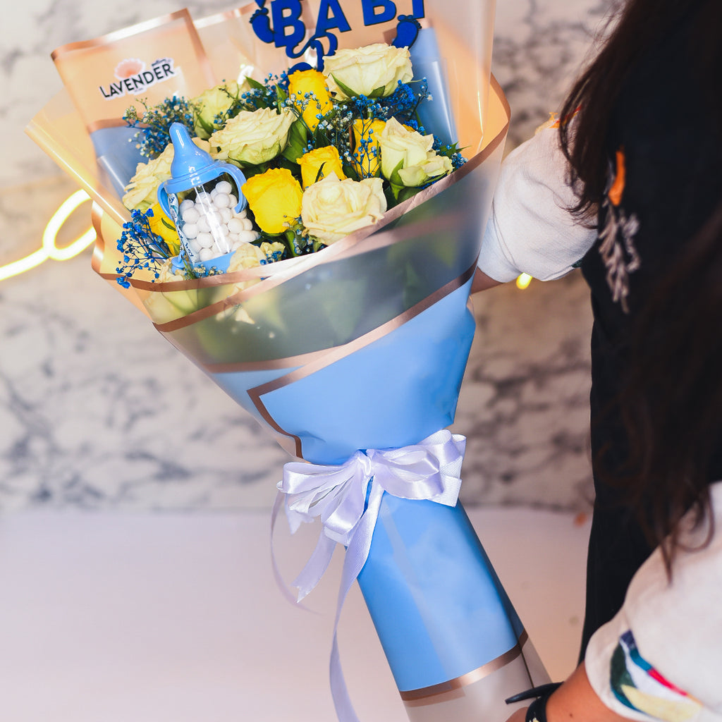 yellow and white roses and blue gypsophila