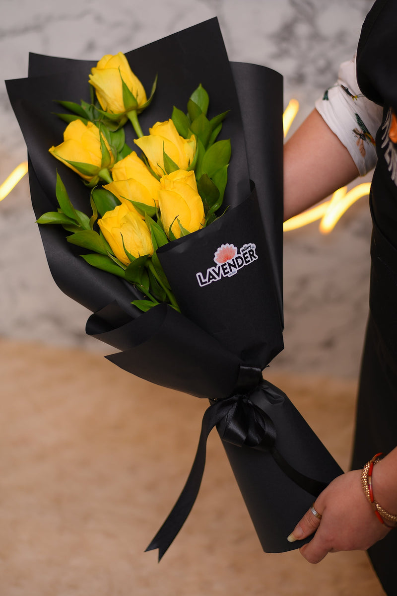 Yellow roses and green leaves