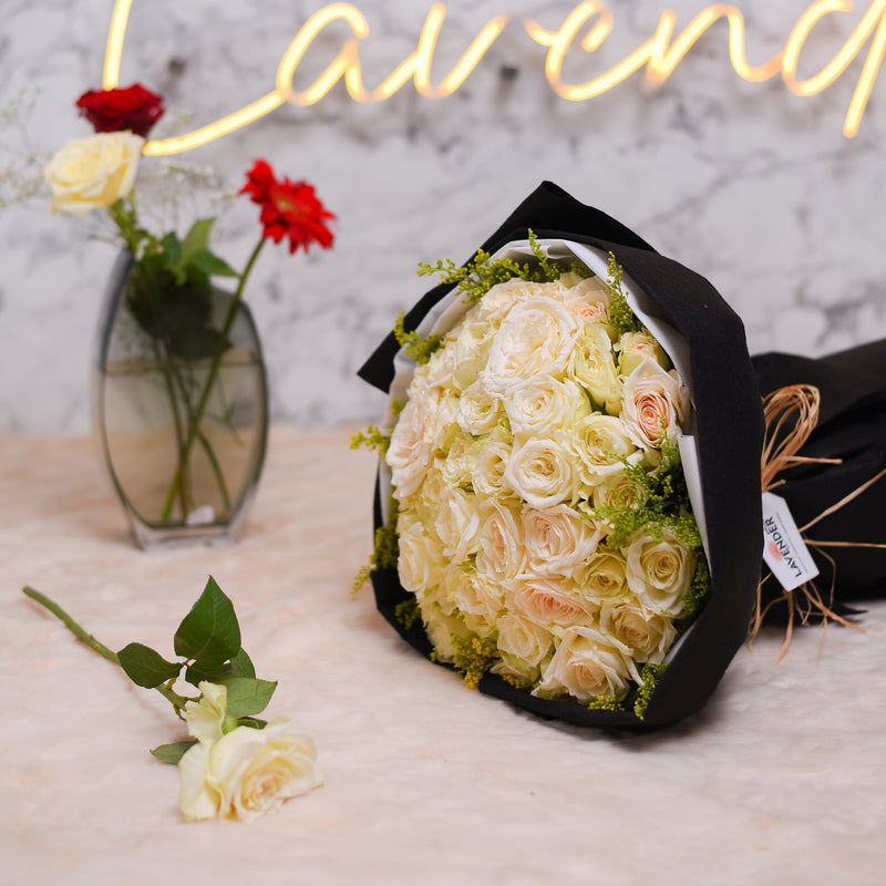 white roses and Natural green leaves