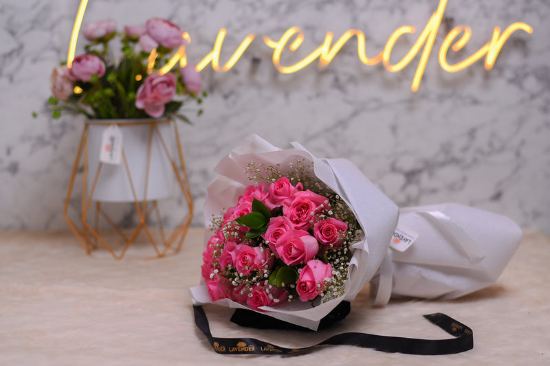 pink roses .white gypsophila and green leaves