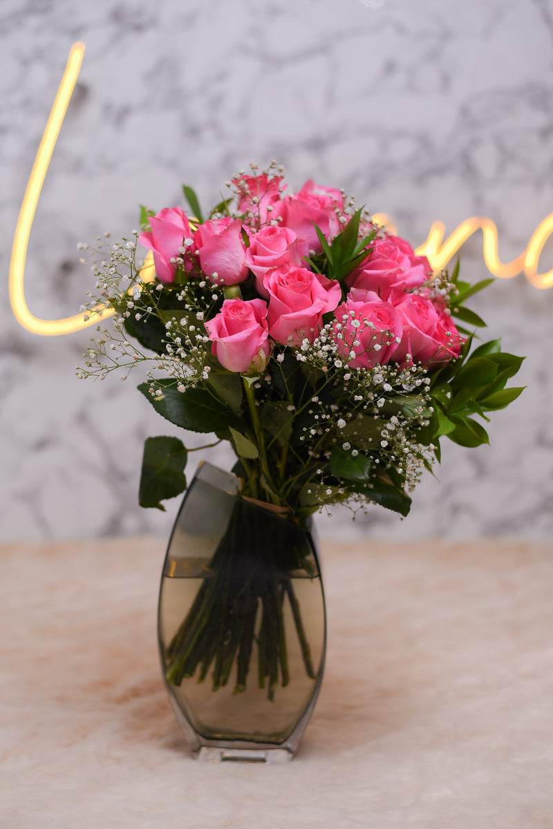pink roses .Natural white gypsophila and Natural green leaves