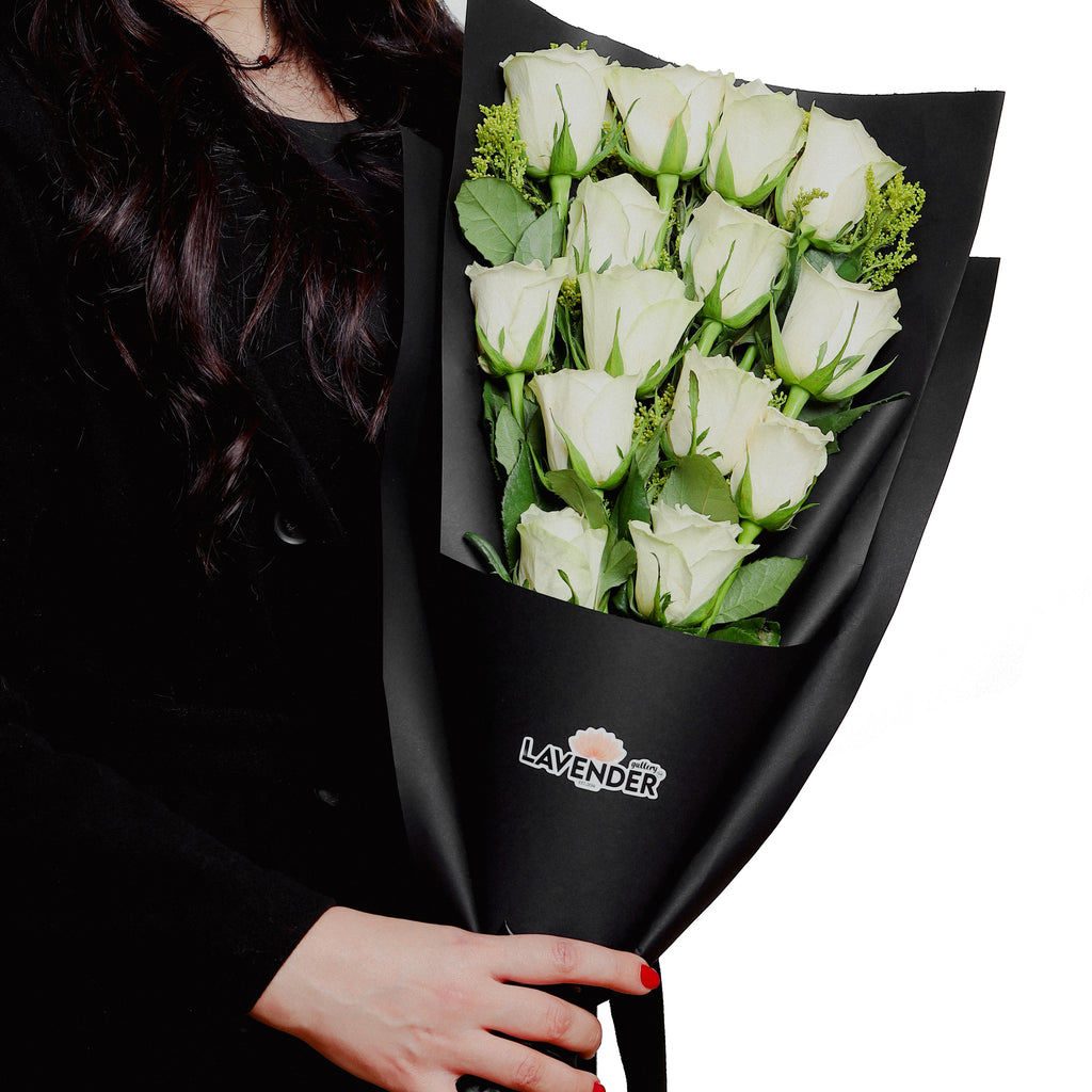 white roses and  green leaves