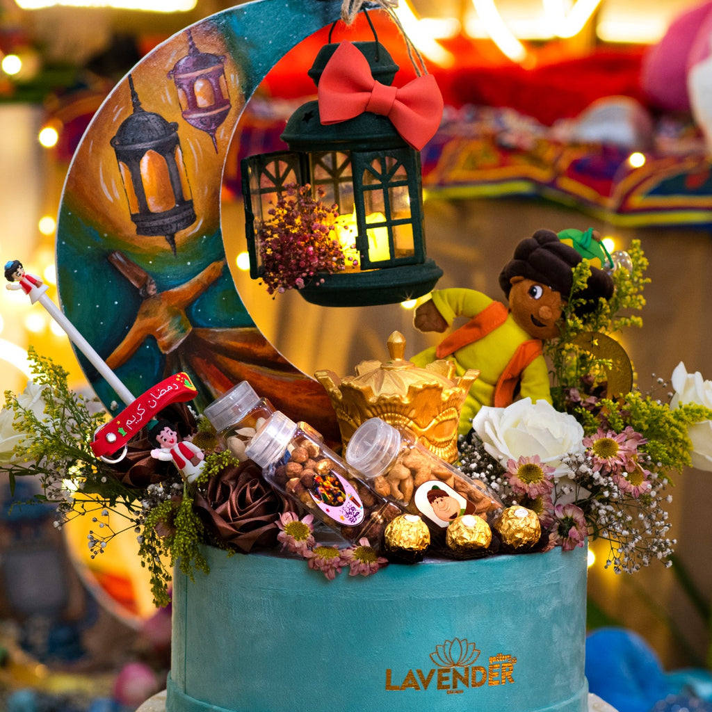 Decorative cake with fairy tale elements and 'Lavender' branding in a festive setting.
