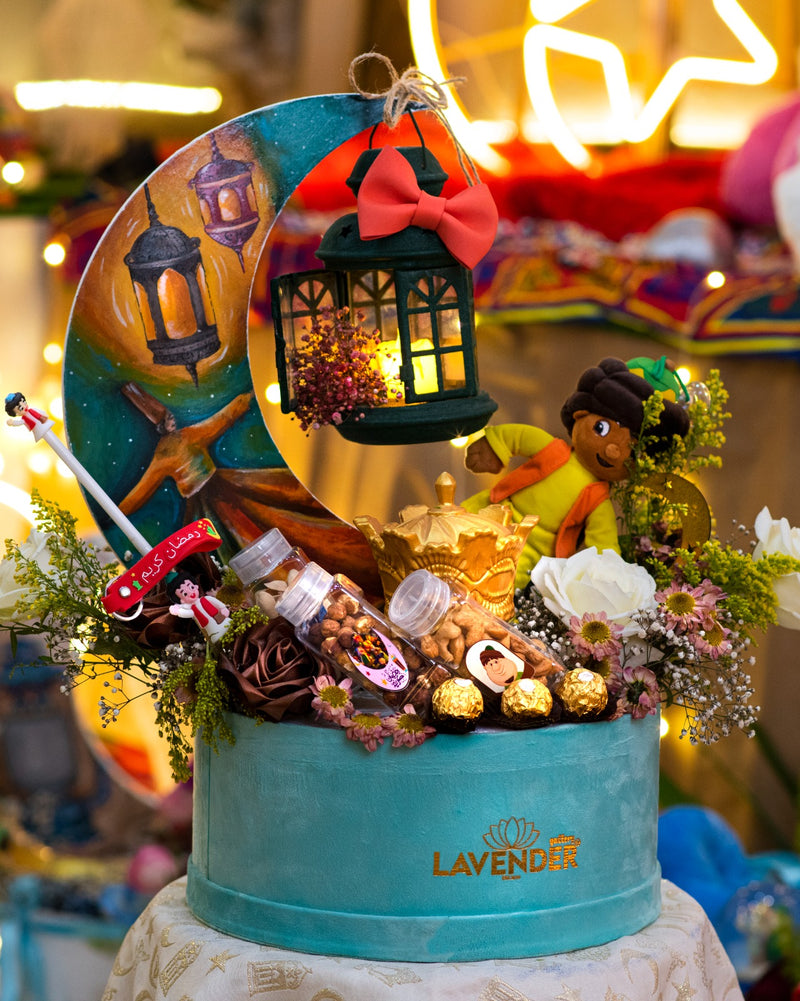 Decorative cake with fairy tale elements and 'Lavender' branding in a festive setting.