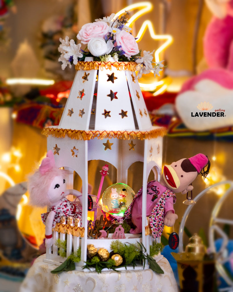 Decorative carousel with plush toys and flowers on a blurred festive background