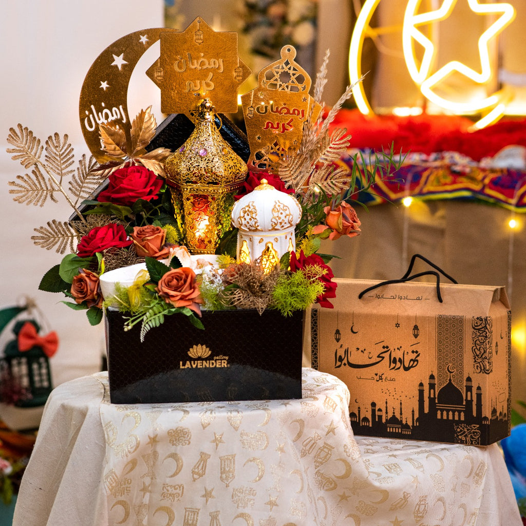 Decorative floral arrangement with lanterns and 'Lavender' branding on a tablecloth.