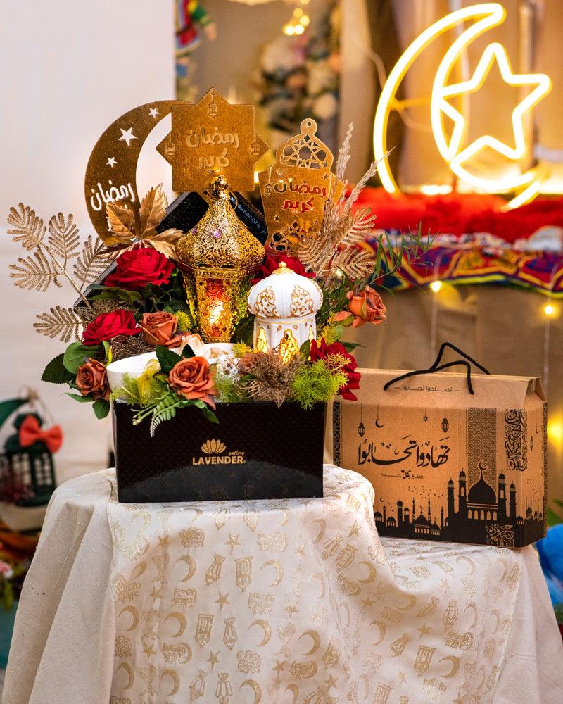 Decorative floral arrangement with lanterns and 'Lavender' branding on a tablecloth.