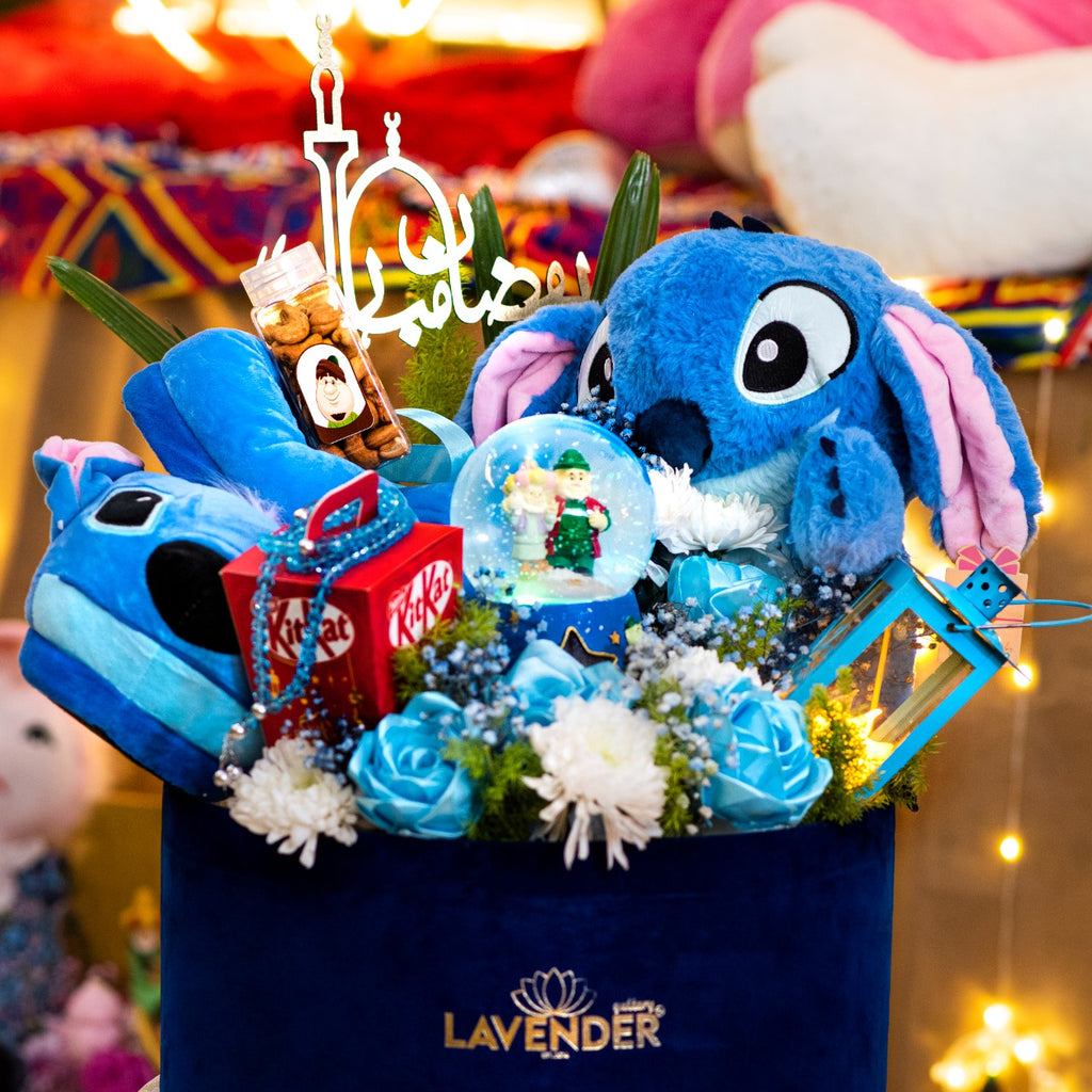 Decorative basket with plush toys and flowers, featuring the brand 'Lavender'.