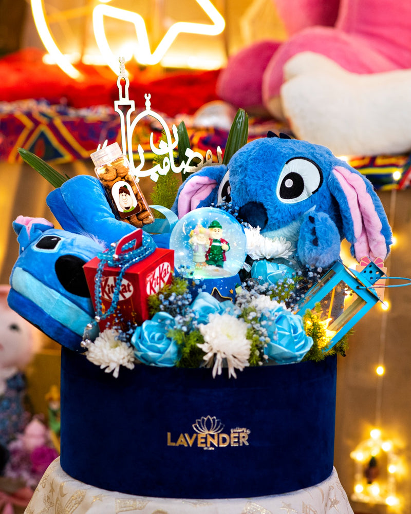 Decorative basket with plush toys and flowers, featuring the brand 'Lavender'.