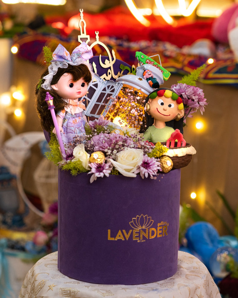 Decorative purple box with dolls and flowers, featuring the Lavender brand logo.