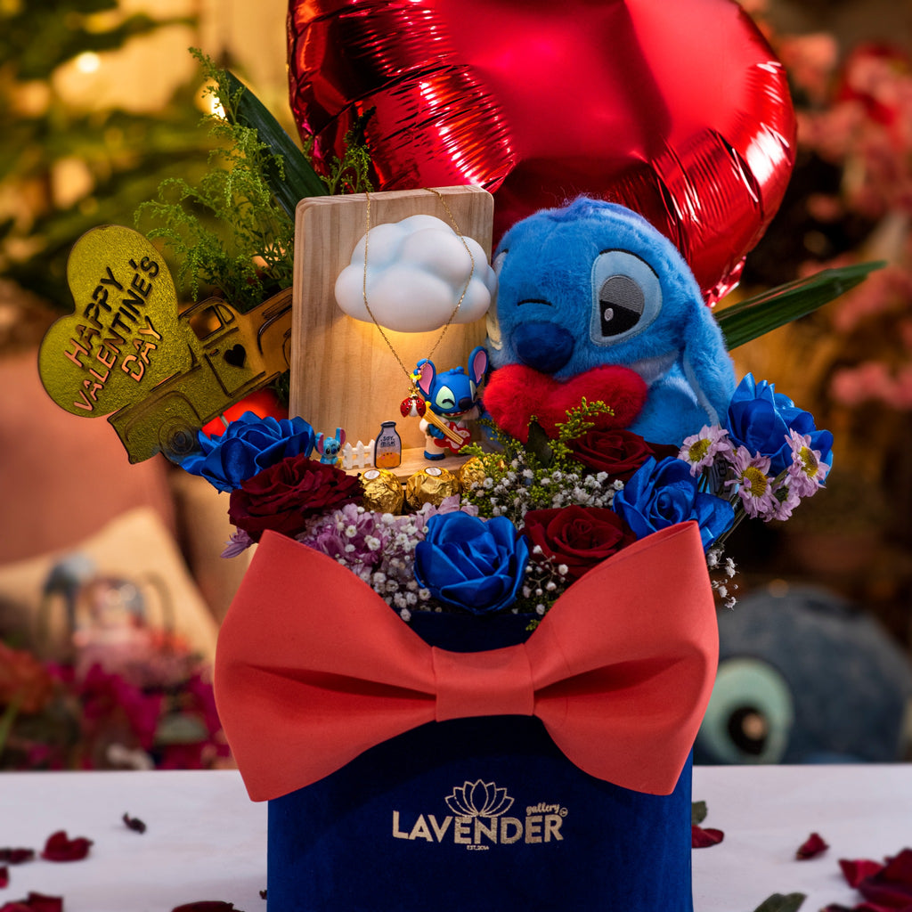 Decorative flower arrangement with a blue character, red balloon, and 'Lavender' branding.