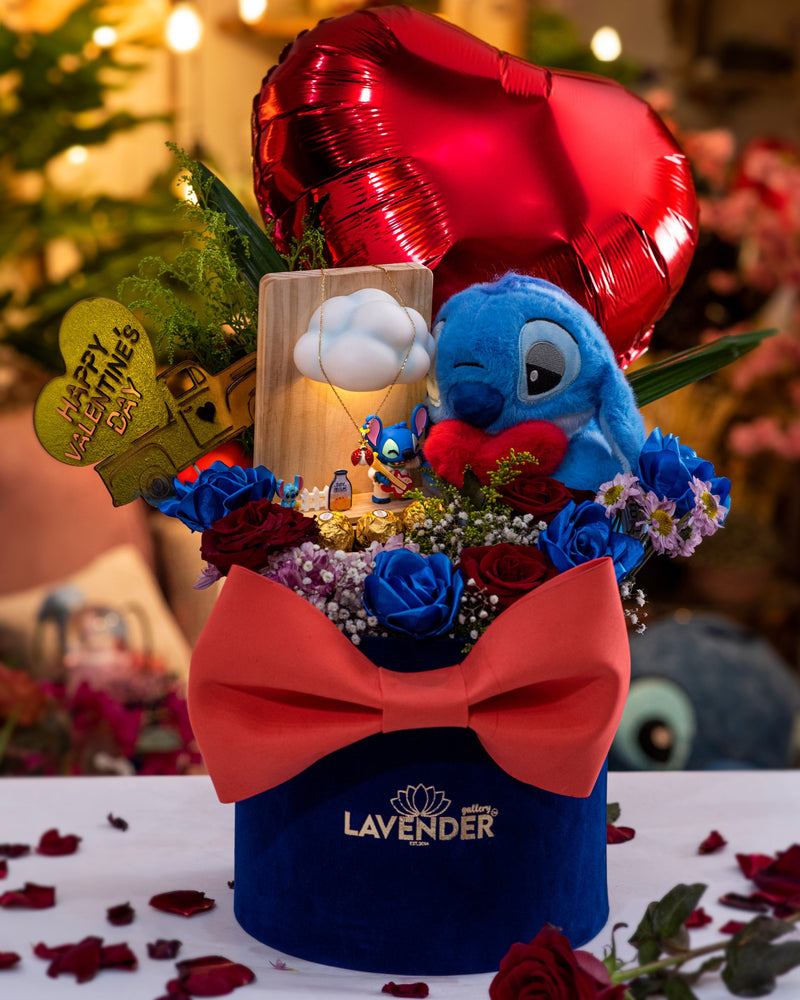 Decorative flower arrangement with a blue character, red balloon, and 'Lavender' branding.