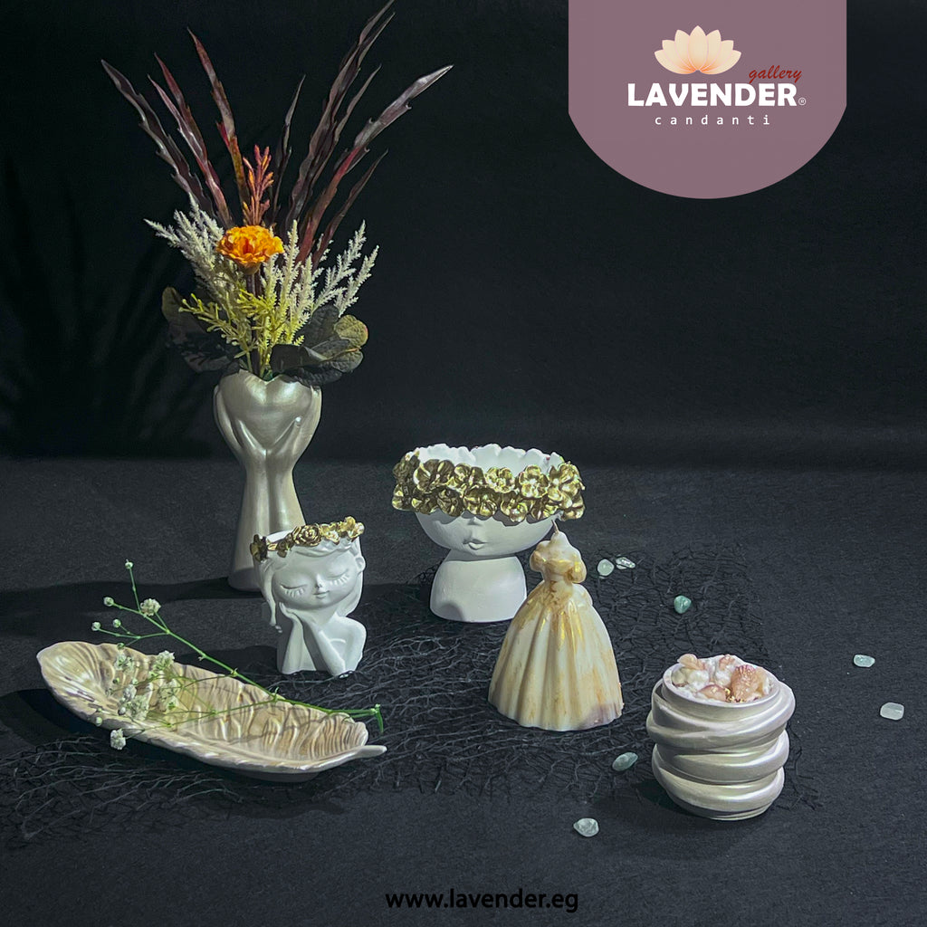 Collection of decorative ceramic pieces on a dark surface 